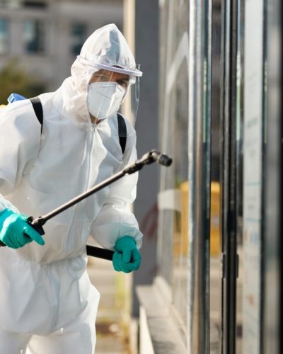 sanitation-worker-hazmat-suit-disinfecting-public-building-during-coronavirus-epidemic